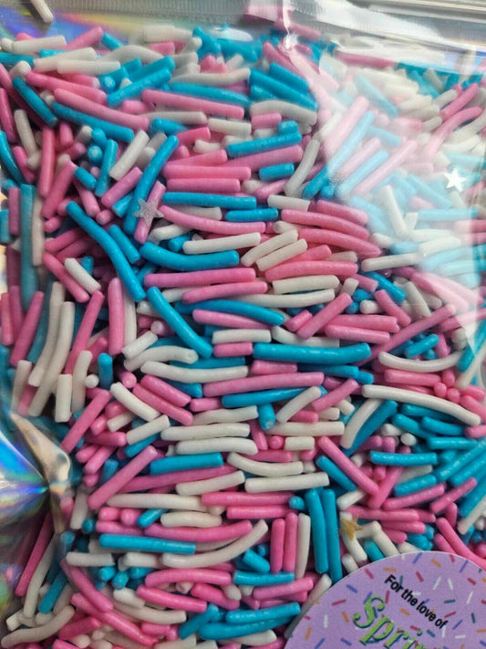 Mr Beast sprinkles, gender reveal cake, jimmies, pink, blue and white sprinkles